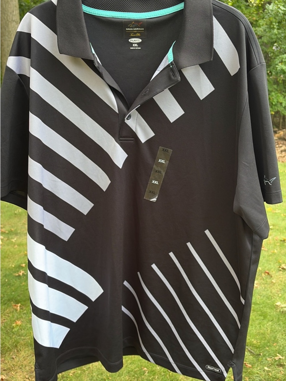Greg Norman Collection Black Polo with White Diagonal Stripe Design